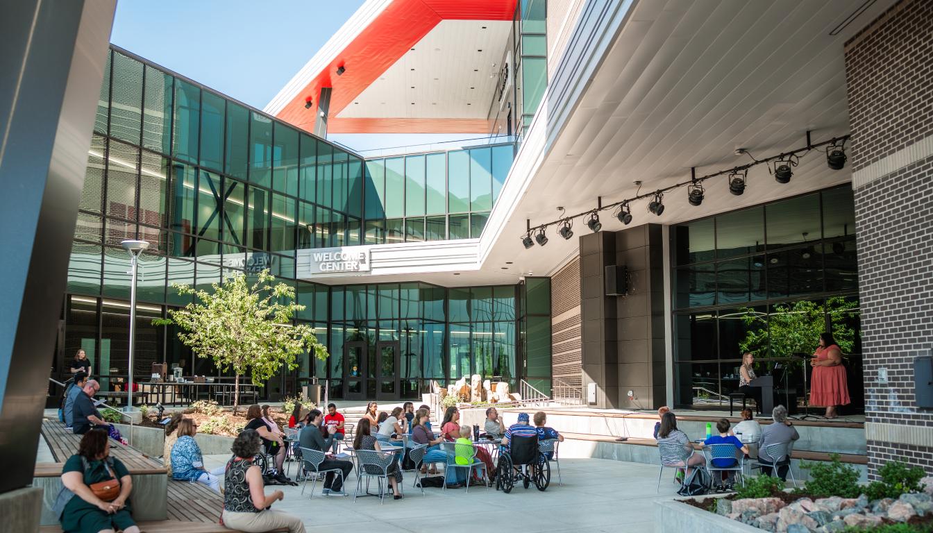 Students, faculty and guests gather for a summer music recital at the Aims Welcome Center