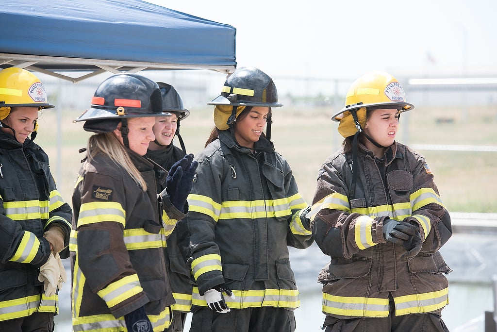 Aims fire science Xplore Academy students wearing fire safety gear