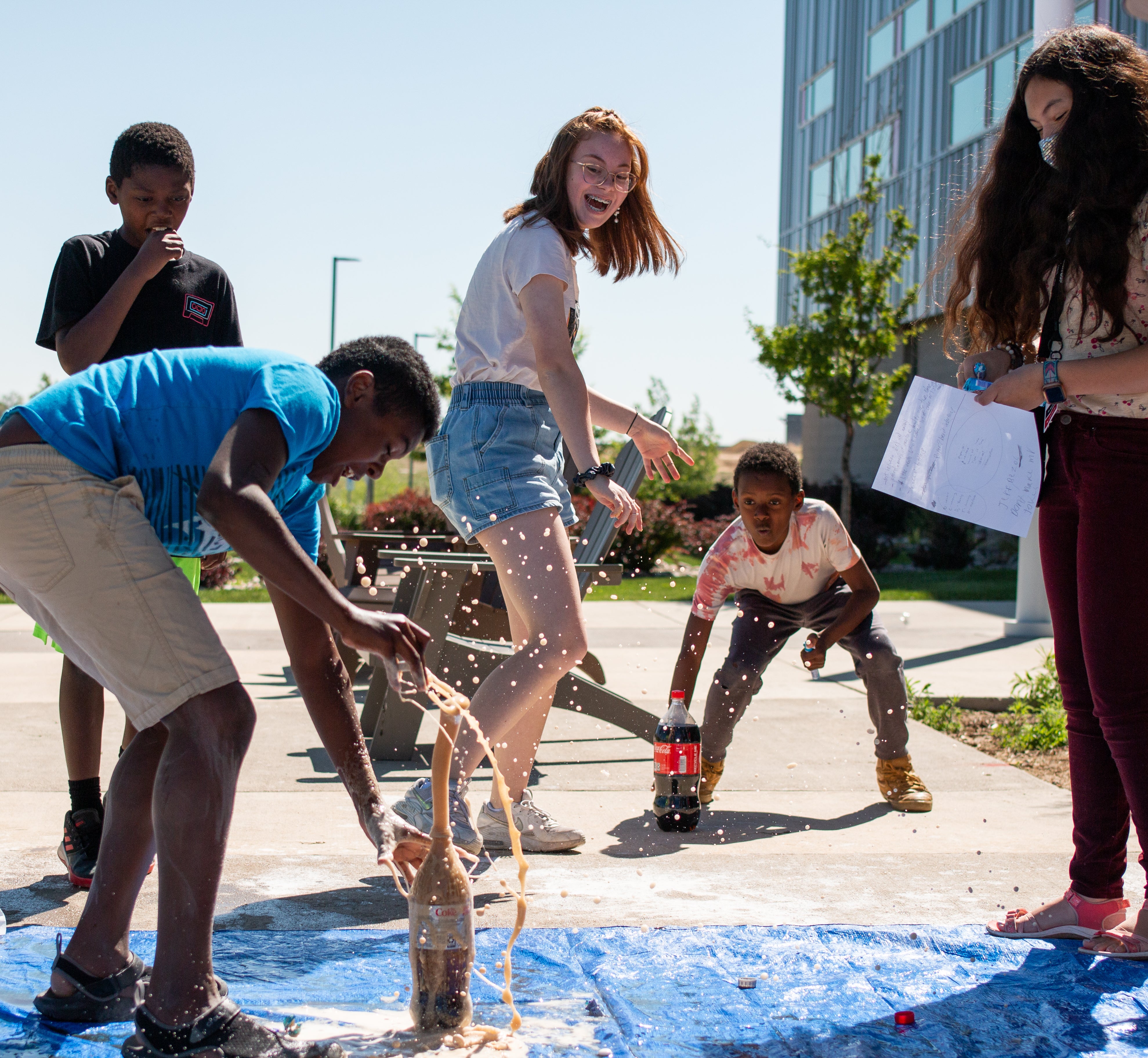 College for kids, group of kids experimenting with Mentos and Diet Coke