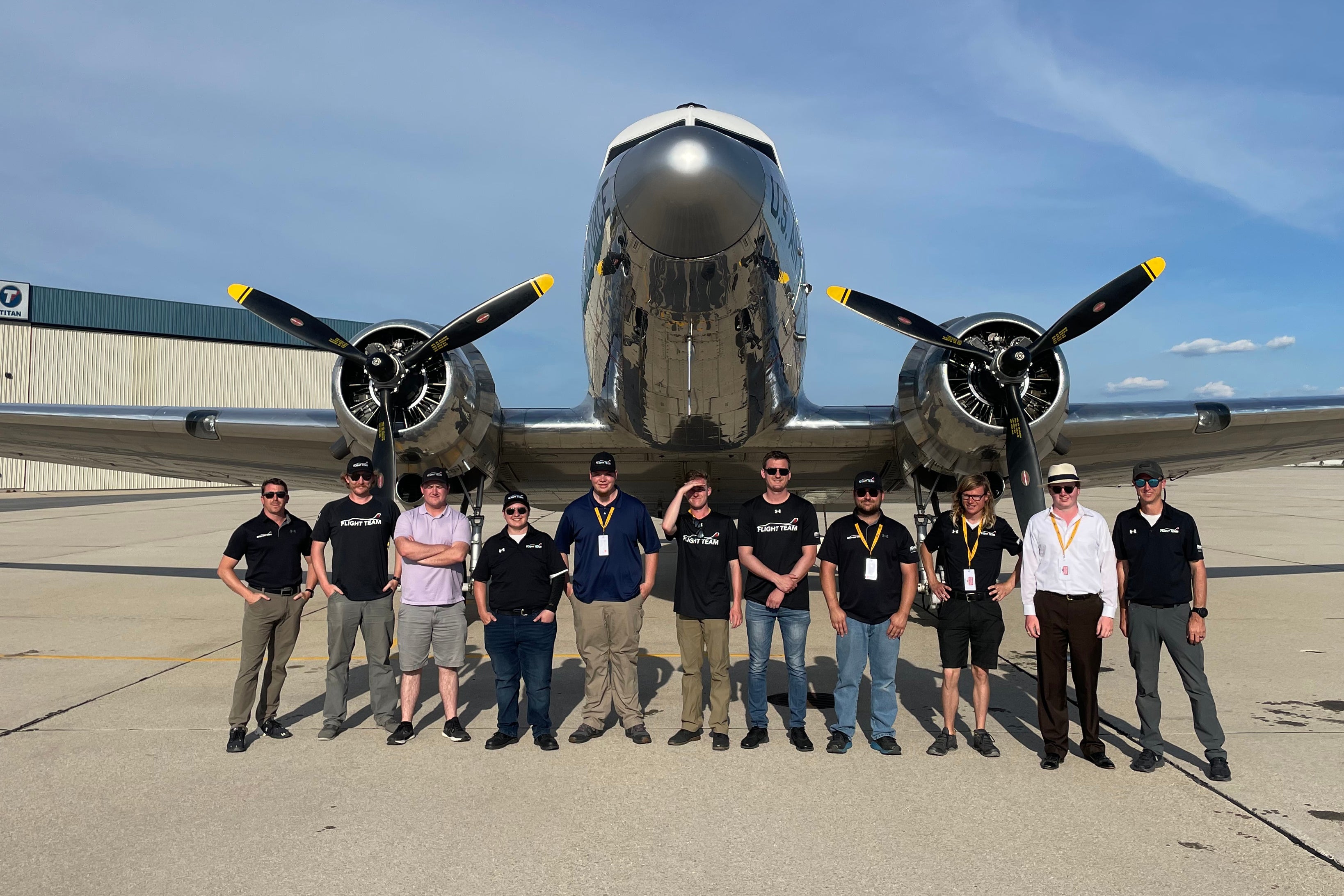 Aims Flight Team posing in front of plane