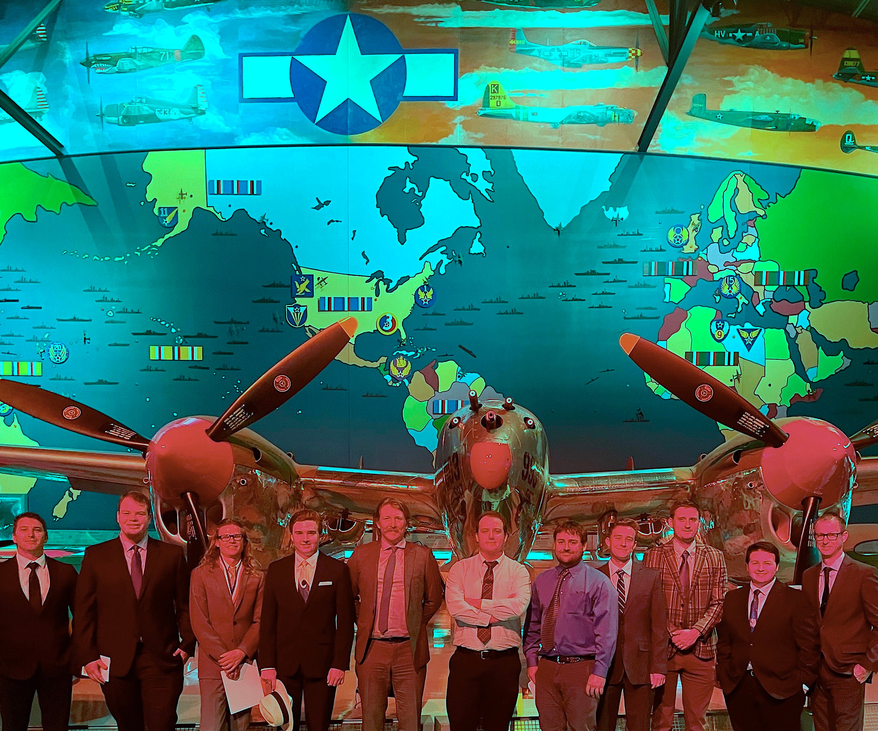 Aims Flight team in front of map