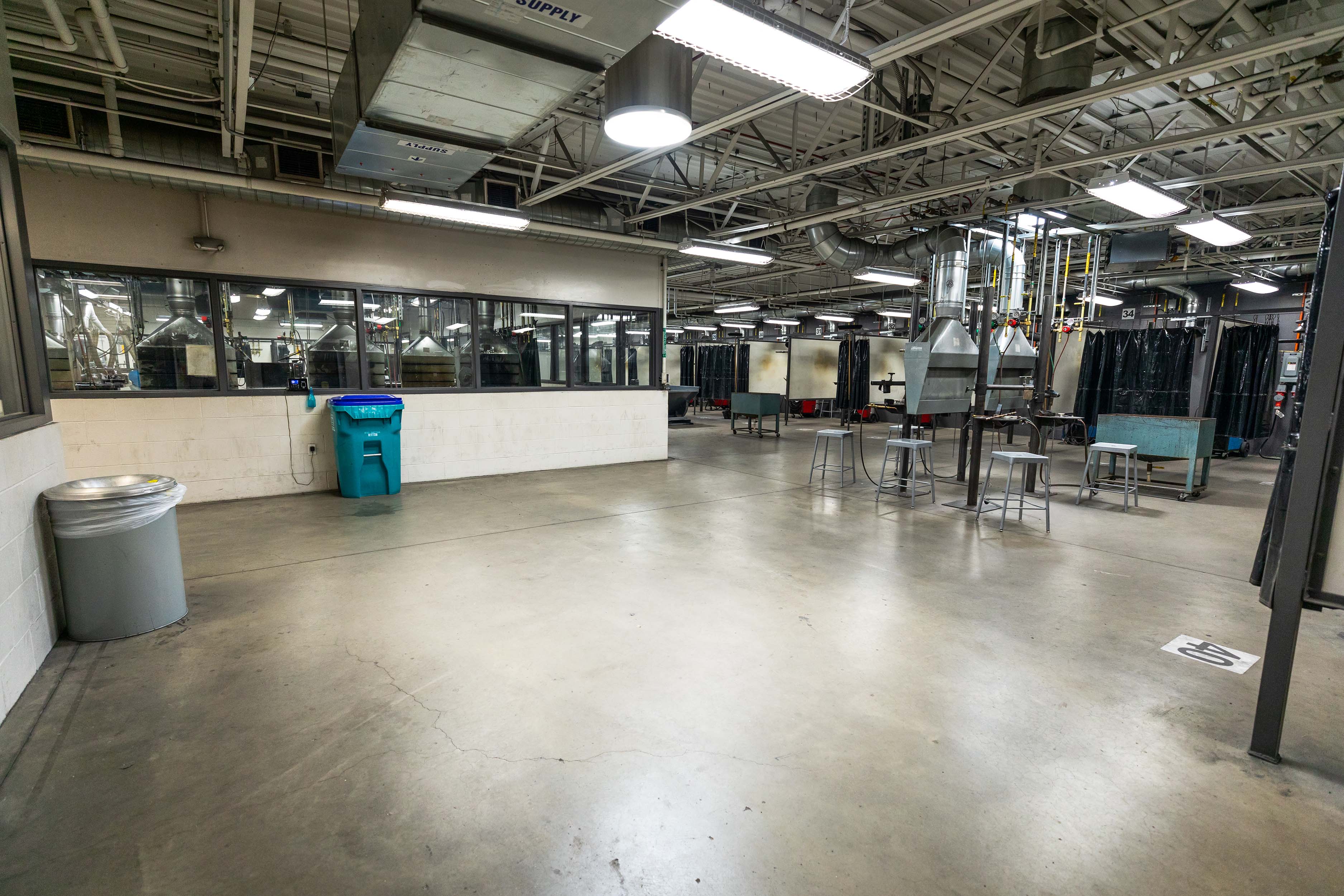 Interior photo of the Welding Lab. Work spaces for welding students to work on projects.