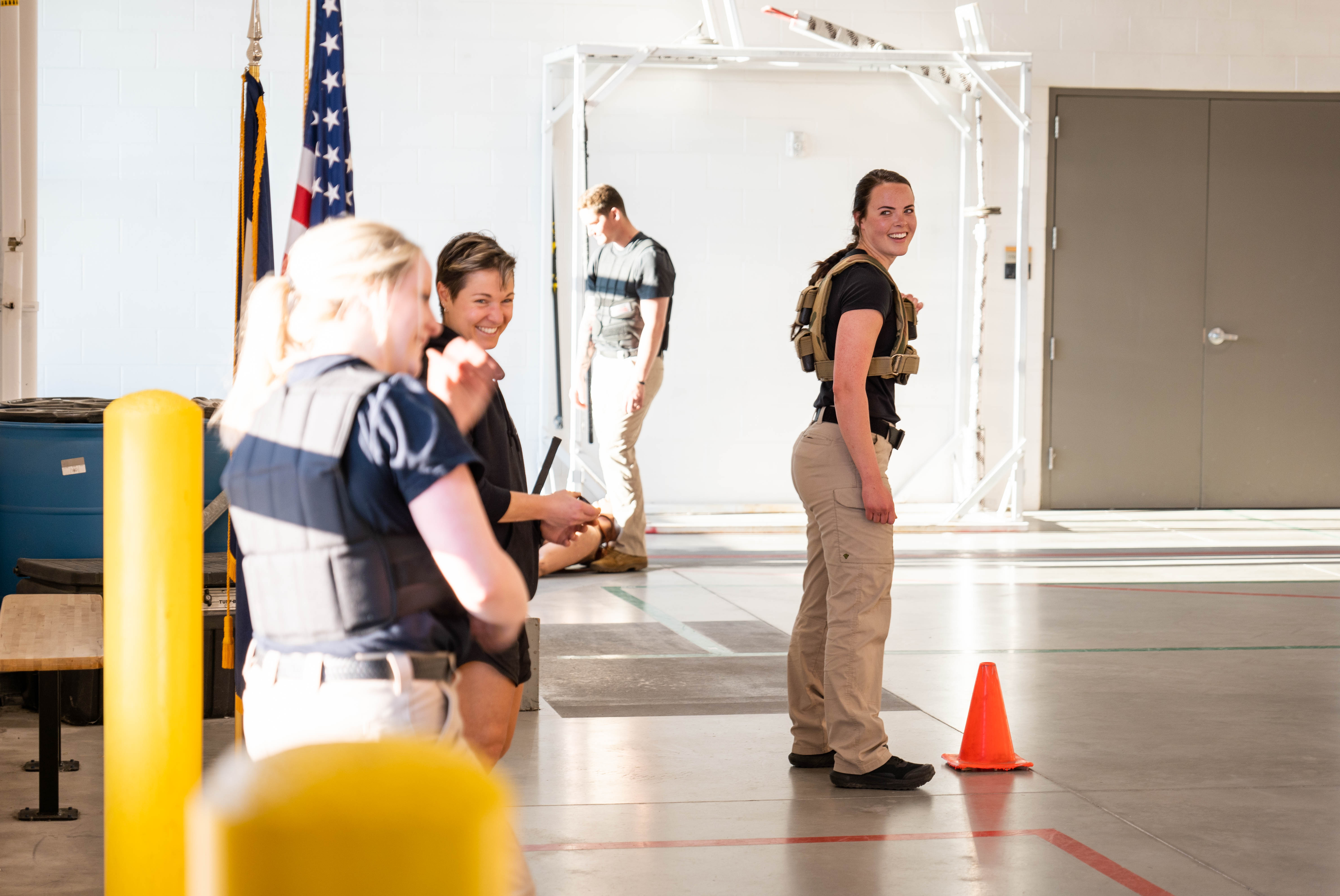Aims Peace Officer Academy cadets sharing a laugh during a tactical physical training exercise