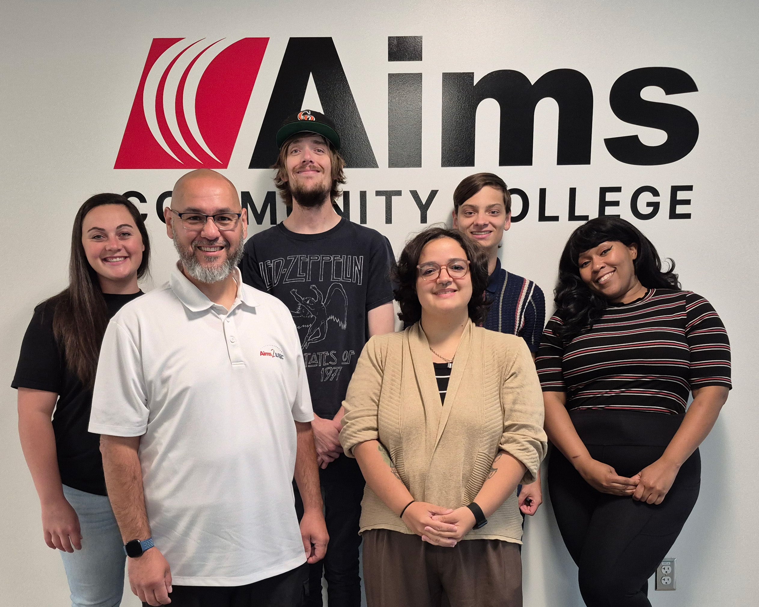 2025 Student Government Administration standing in front of the Aims logo.