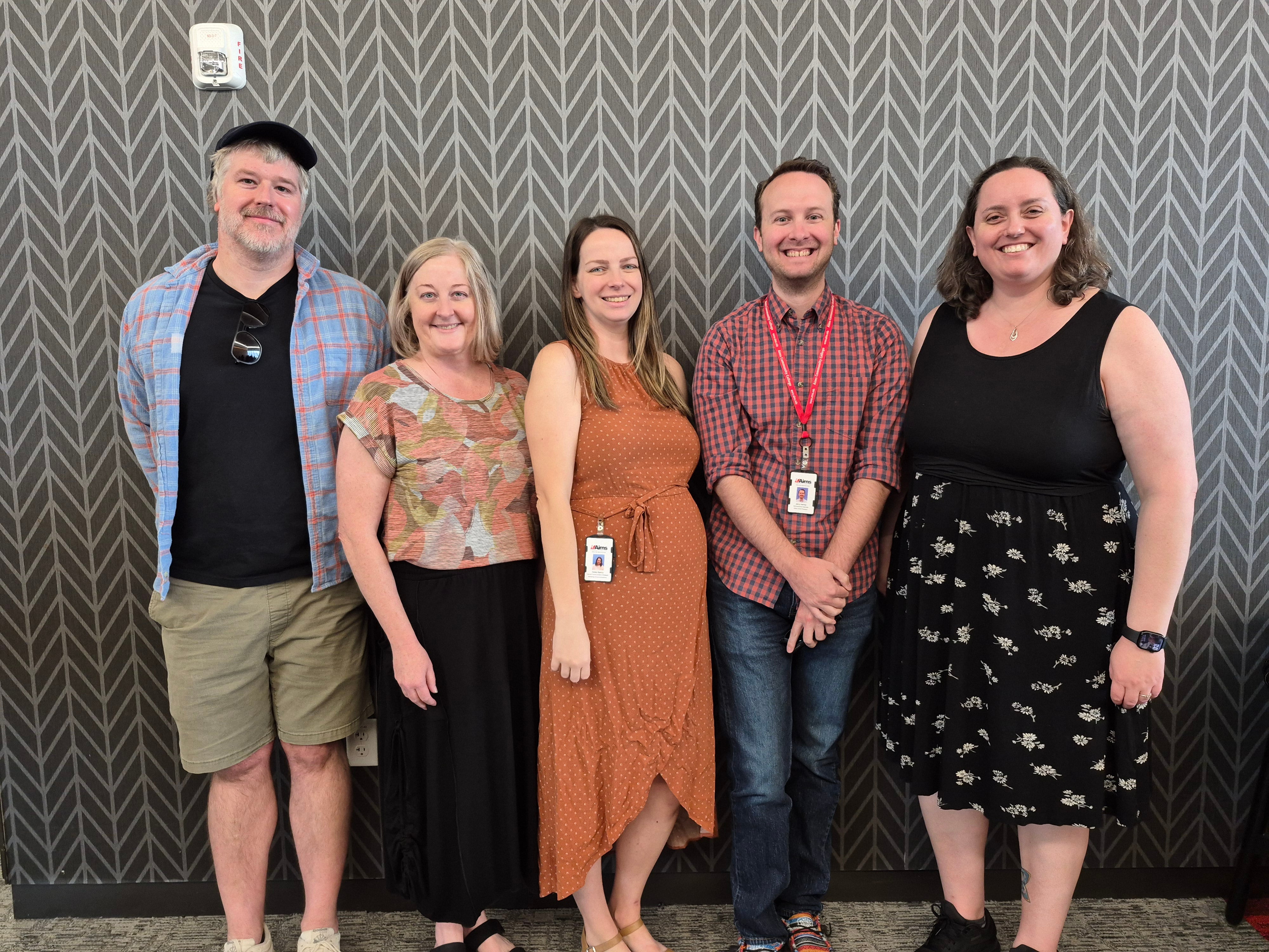 Some of the Civic Engagement Council members standing and smiling together.
