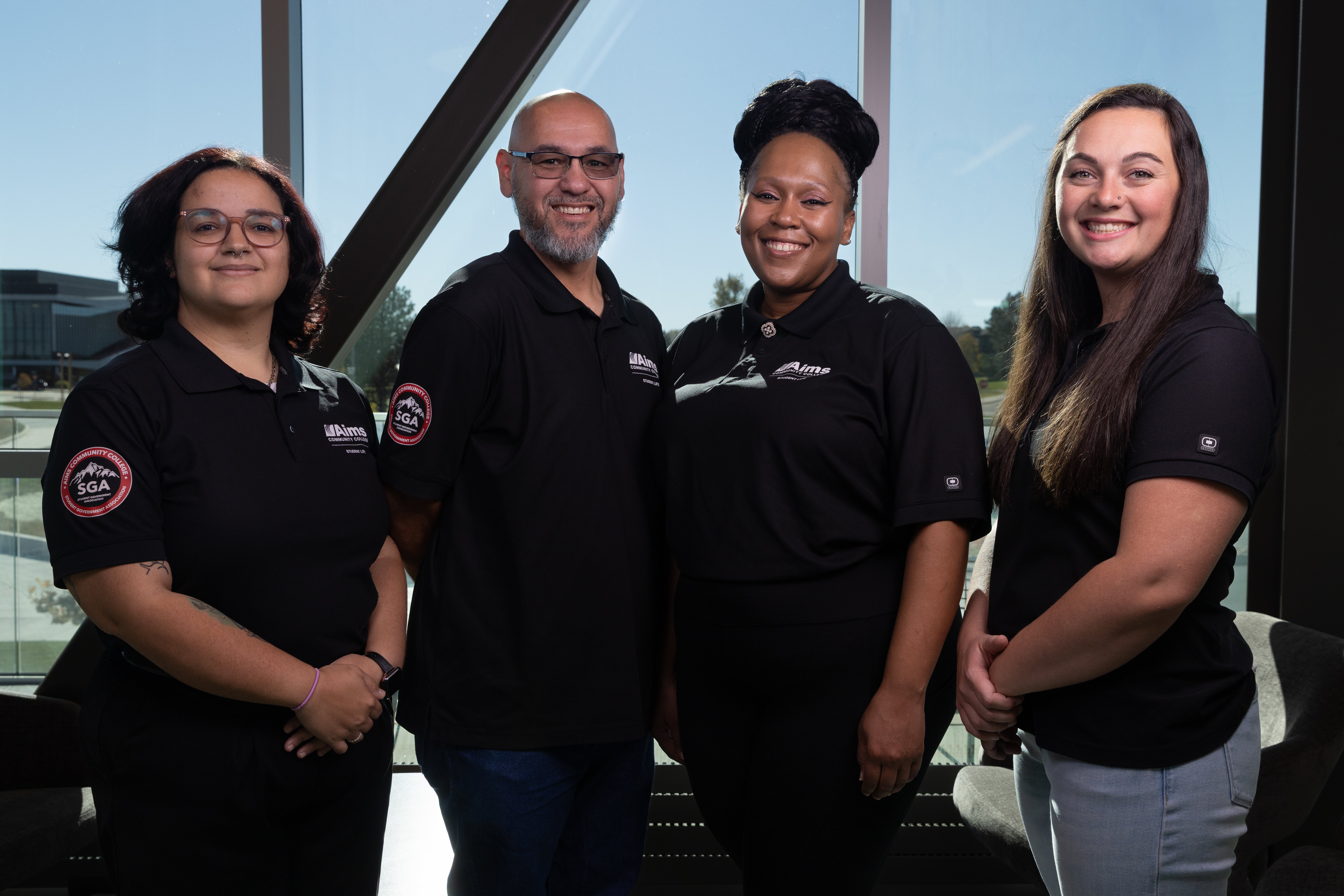 2025 Student Government Administration standing in uniform in front of a window.