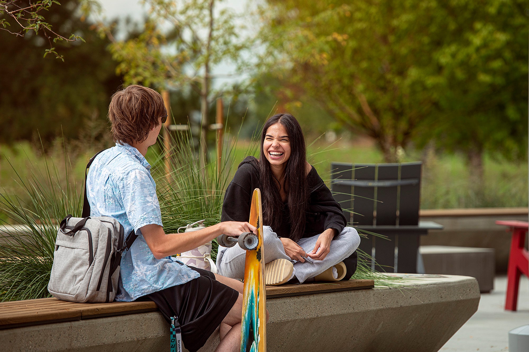 Two students talk outside on the Aims Greeley Campus
