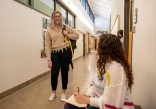 Aims students meeting in Westview hallway