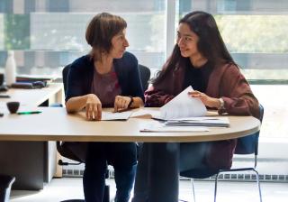 An Aims student discussing financial aid options with an advisor