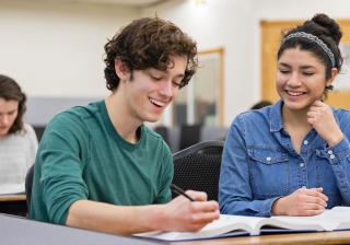 Students working together in class at Aims Community College