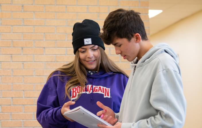 Students looking at scheduling