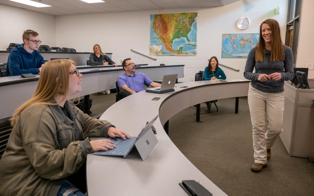 Students engaging with an instructor in class at Aims Community College