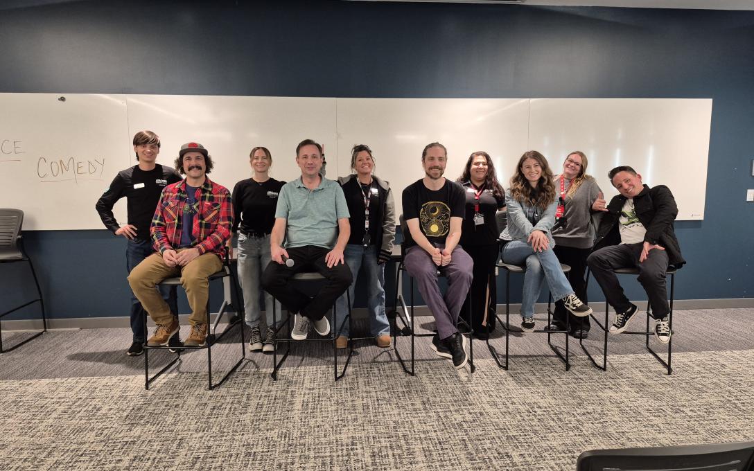 The Arty's Recovery Connection student workers standing behind the comedians from the Second Chance Comedy Show..