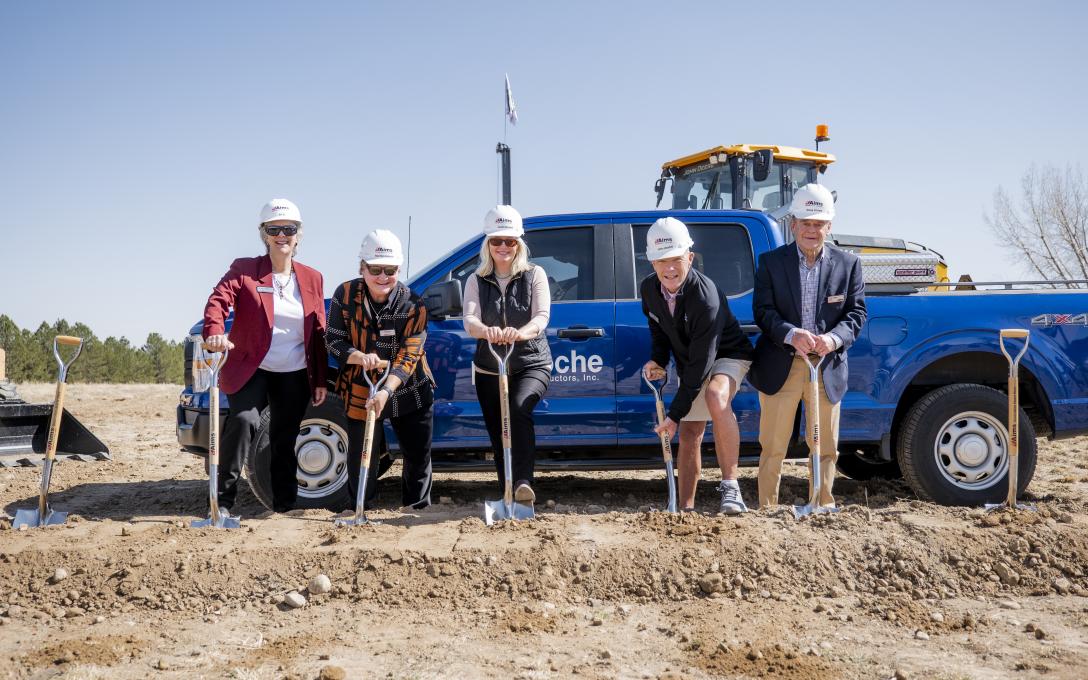 People with shovels at groundbreaking ceremony