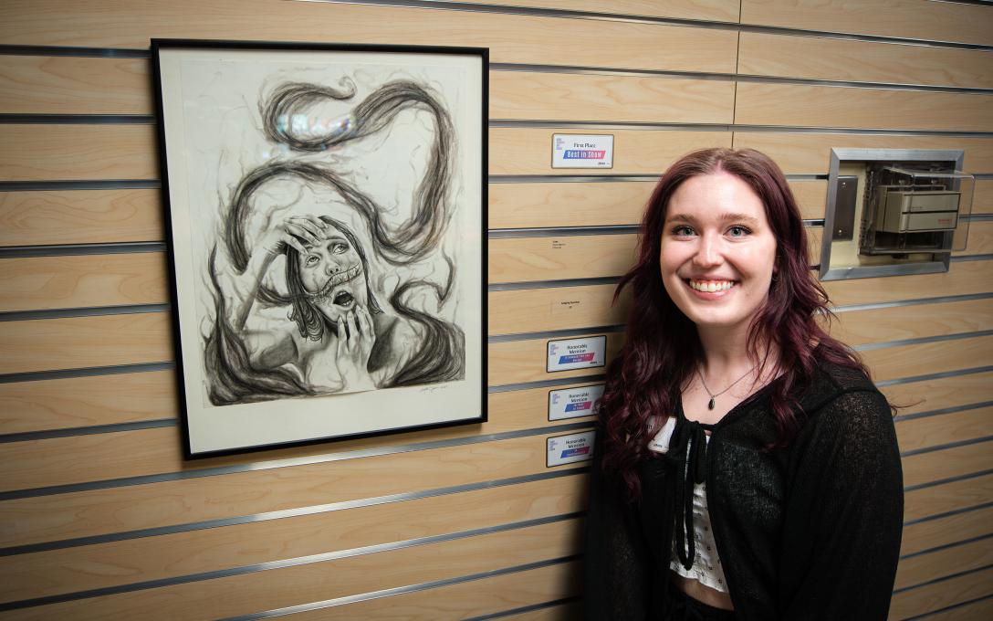 Kayla Sigmon with her art