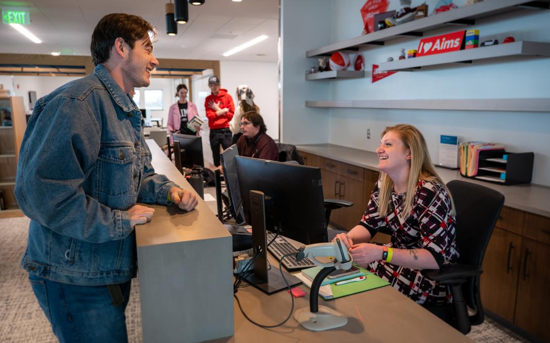 Zack at the front desk at the Learning Commons
