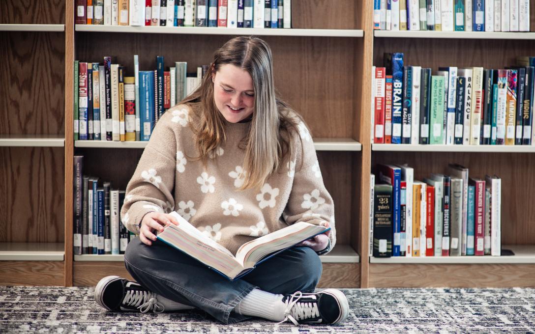 Maddie Loeffler in Library Reading