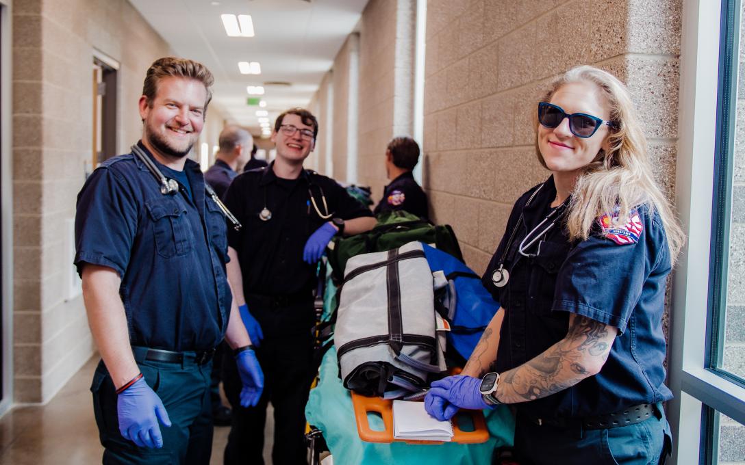 Skylar with classmates and an EMT Gurney