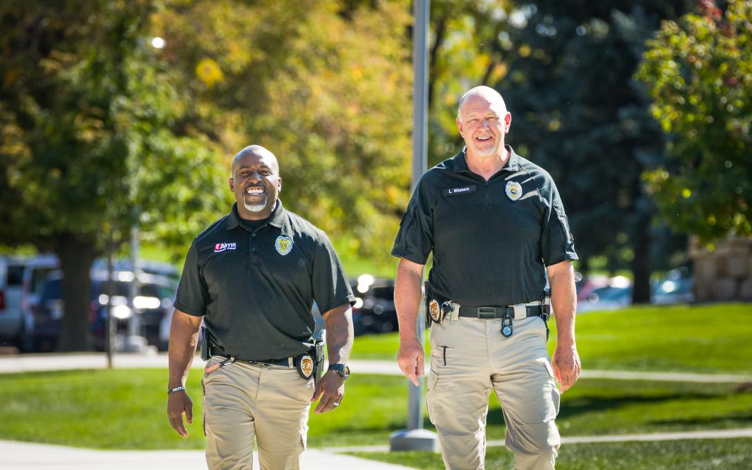 Two Aims Campus Safety and Security staff members walking on Greeley Campus