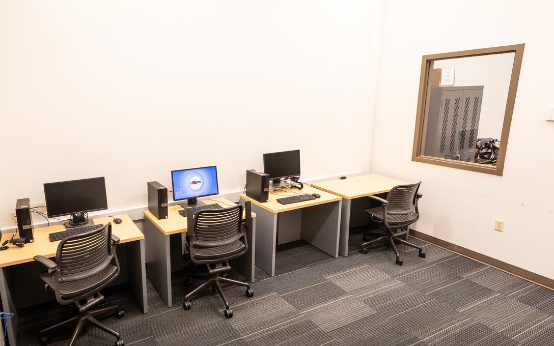 A secured room with computers and monitoring equipment for students taking supervised tests on the Fort Lupton campus.