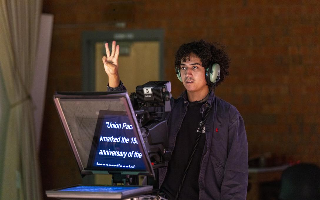 An Aims Television and Video Production student working in a TV studio 