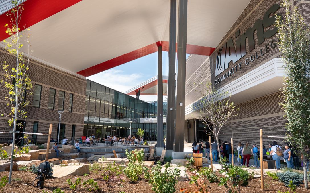 Aims Welcome Center Courtyard outdoor gathering space with tables, chairs, benches, and landscaping