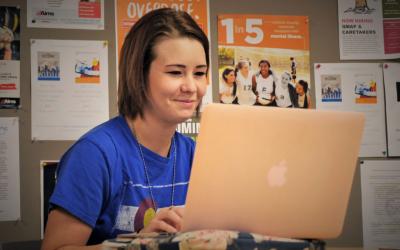 An Aims student using a laptop