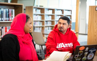 Students studying together at a table in the Kiefer Library.