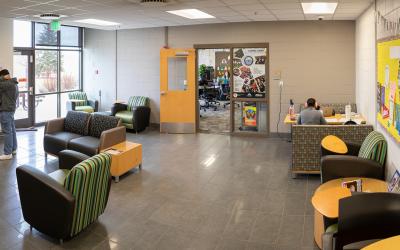 Students seated at tables and booths in the Prairie Building Student Lounge