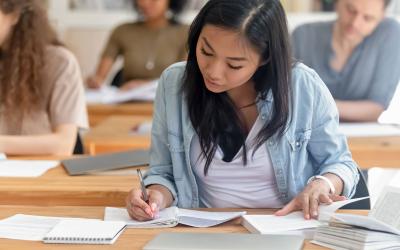 Media Writing student working on paper