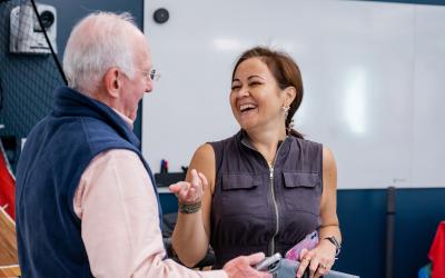 Adult Education student and instructor laughing together