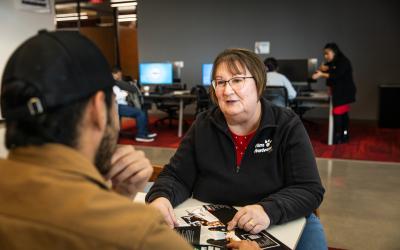 A financial aid representative at Aims talks with a student about options for paying for tuition and other expenses