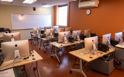 Rows of Apple Mac computers inside a classroom at the Loveland campus.