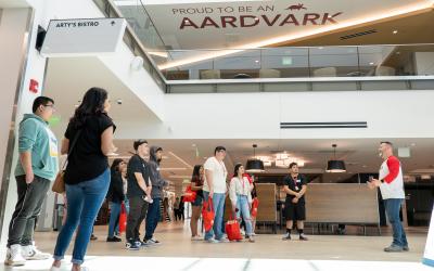 Students gather in the lobby during a tour of the Aims Learning Commons