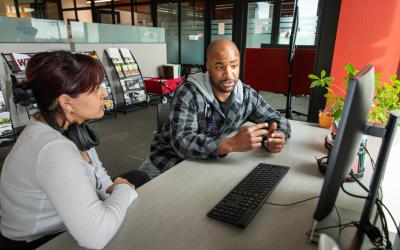 A Career Coach helps a student in the Aims Career Center.