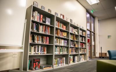 A row of bookshelves in the Fort Lupton Learning Commons.