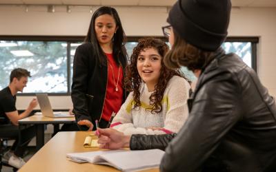 Aims students and instructor in the classroom having a conversation