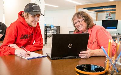 An Aims Community College student and Tutor work together in the Learning Commons on the Greeley Campus.