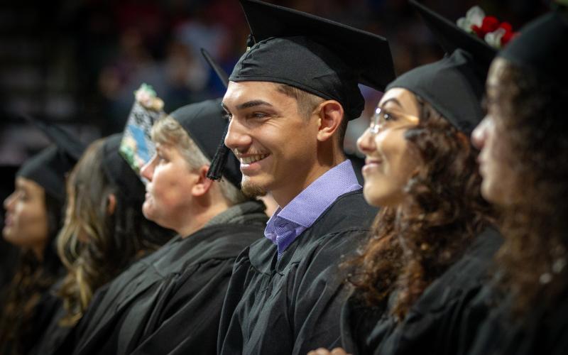 Aims students at commencement ceremony, ready to enter the workforce