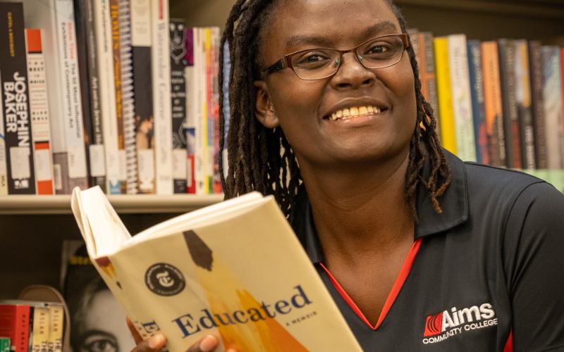 Aims student reading in the Library