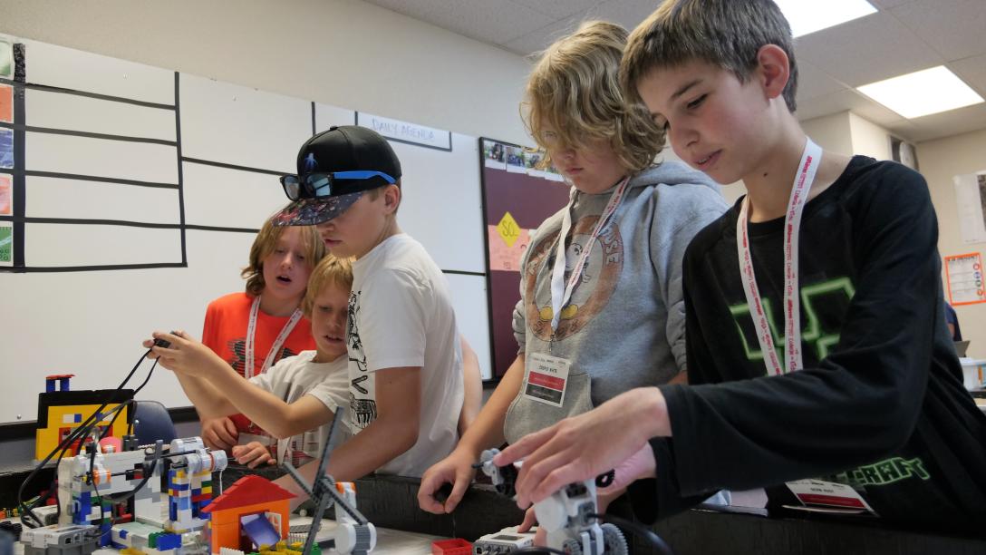 Kids working on Lego and hands on activities at College For Kids