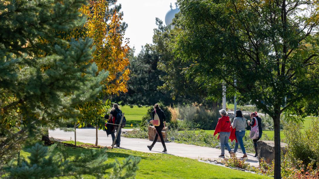 Students walking outdoors on the Aims Community College Greeley campus