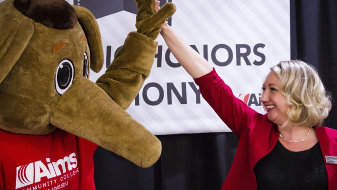 Woman with Aardvark Mascot