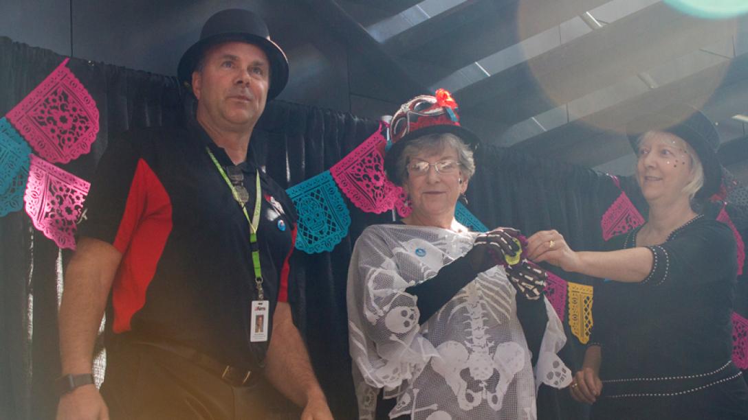 Three people in halloween costumes