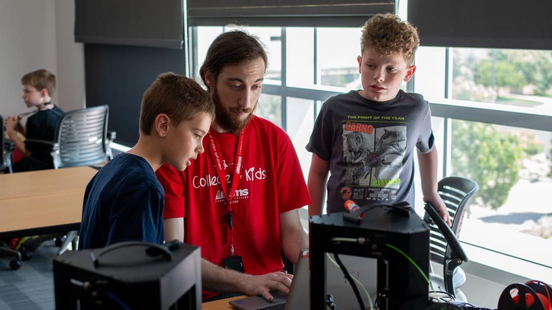 College for kids, two kids learn about machines