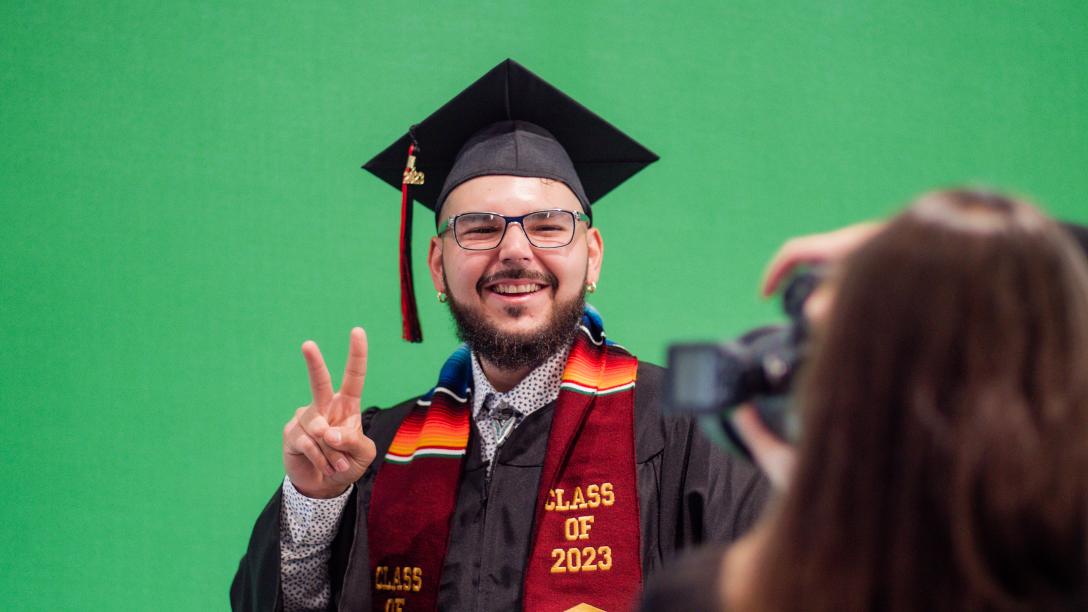 Student posing in cap and gown