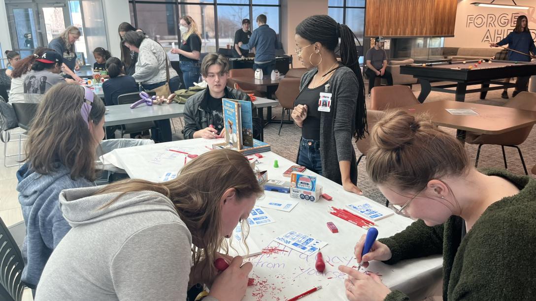 People working on art projects at the Creative Jam