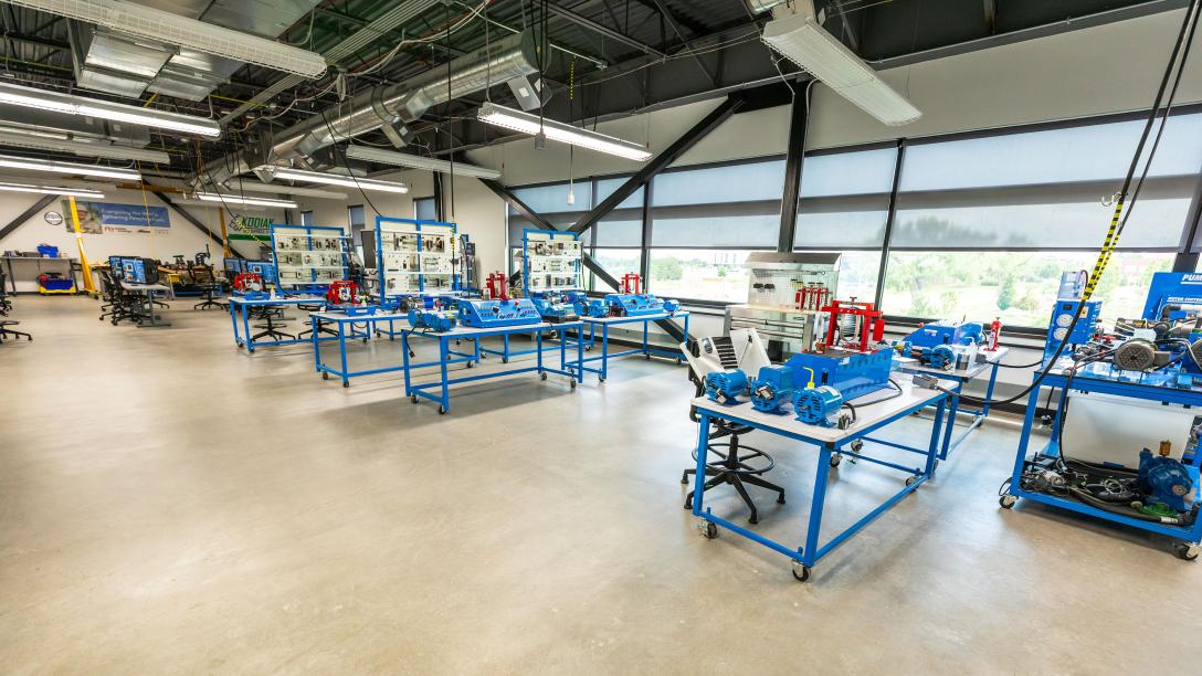 An interior photo of the Fluid Power Lab. Workstations for students to use.