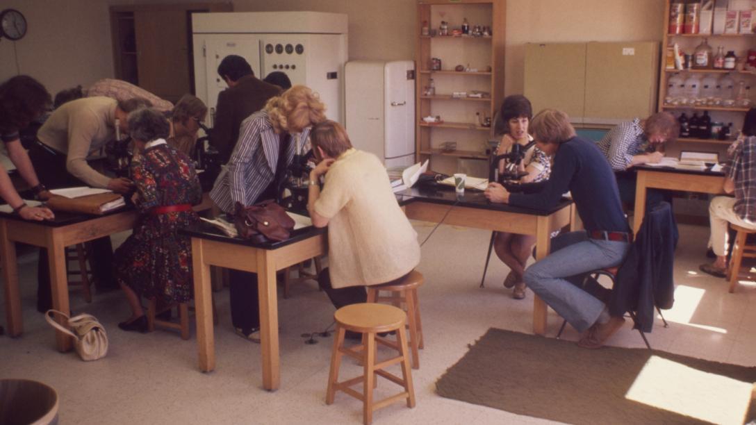 Students using microscopes in a biology class at Aims during the 1970s.