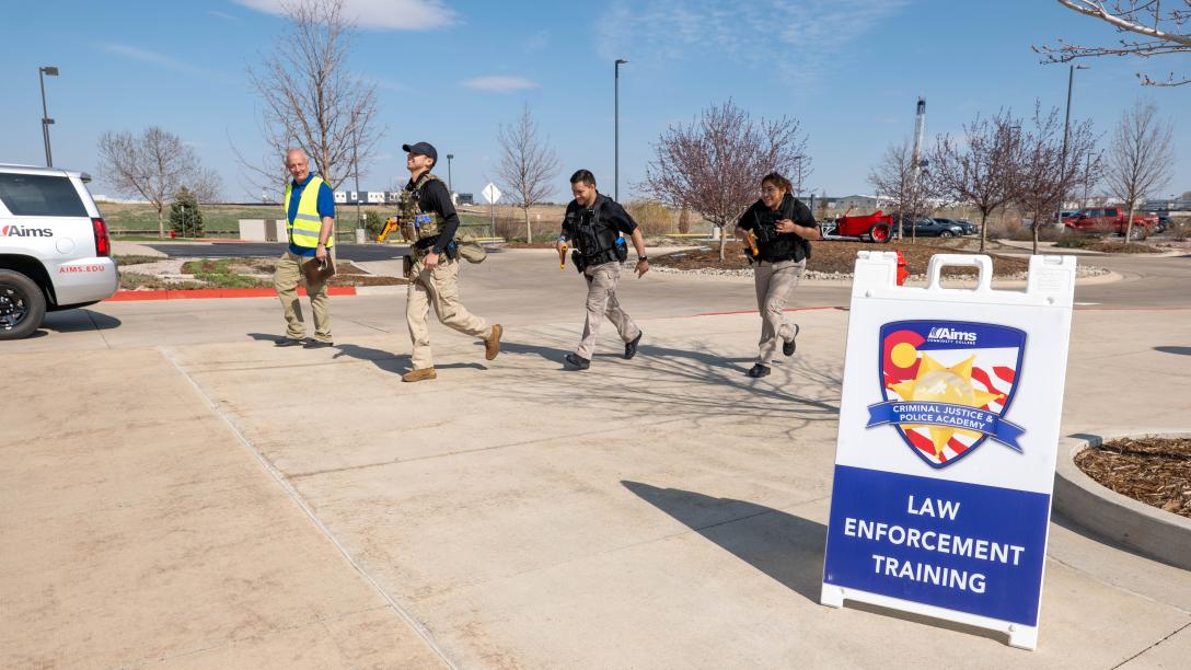 Aims Peace Officer Academy cadets practicing in an outdoor active shooter drill
